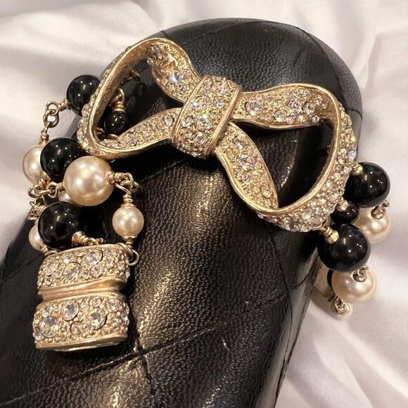 Chanel Black and Gold Bow Bracelet - Picture 1 of 6
